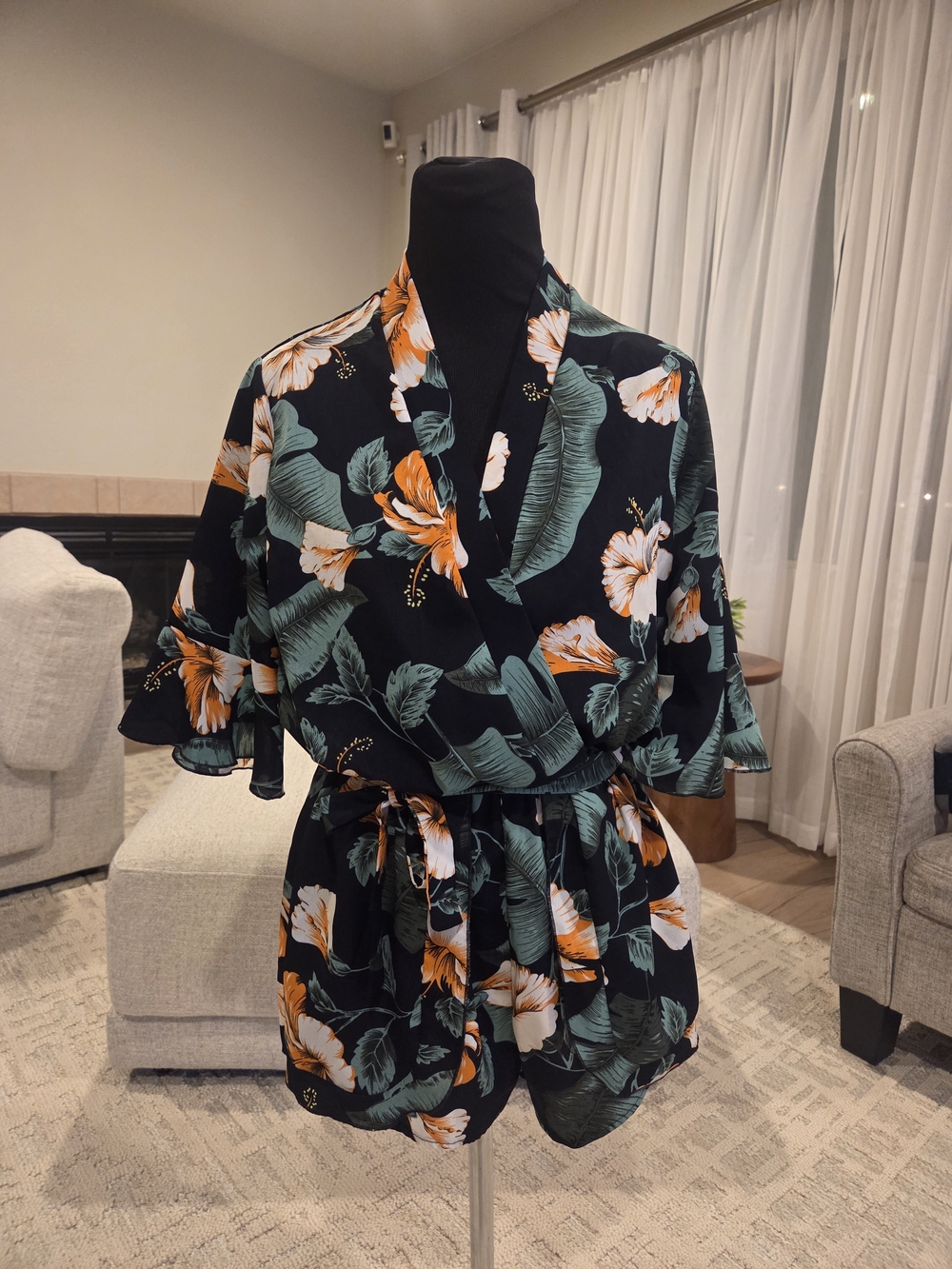 Black Floral Short Wrap Romper with Green Leaves and Orange Blooms
